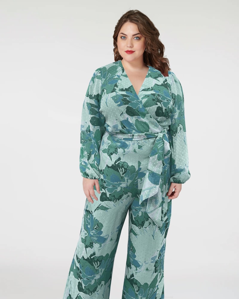 Front of a model wearing a size 1X Floral Faux Wrap Jumpsuit in Green in Green by Marée Pour Toi. | dia_product_style_image_id:290519